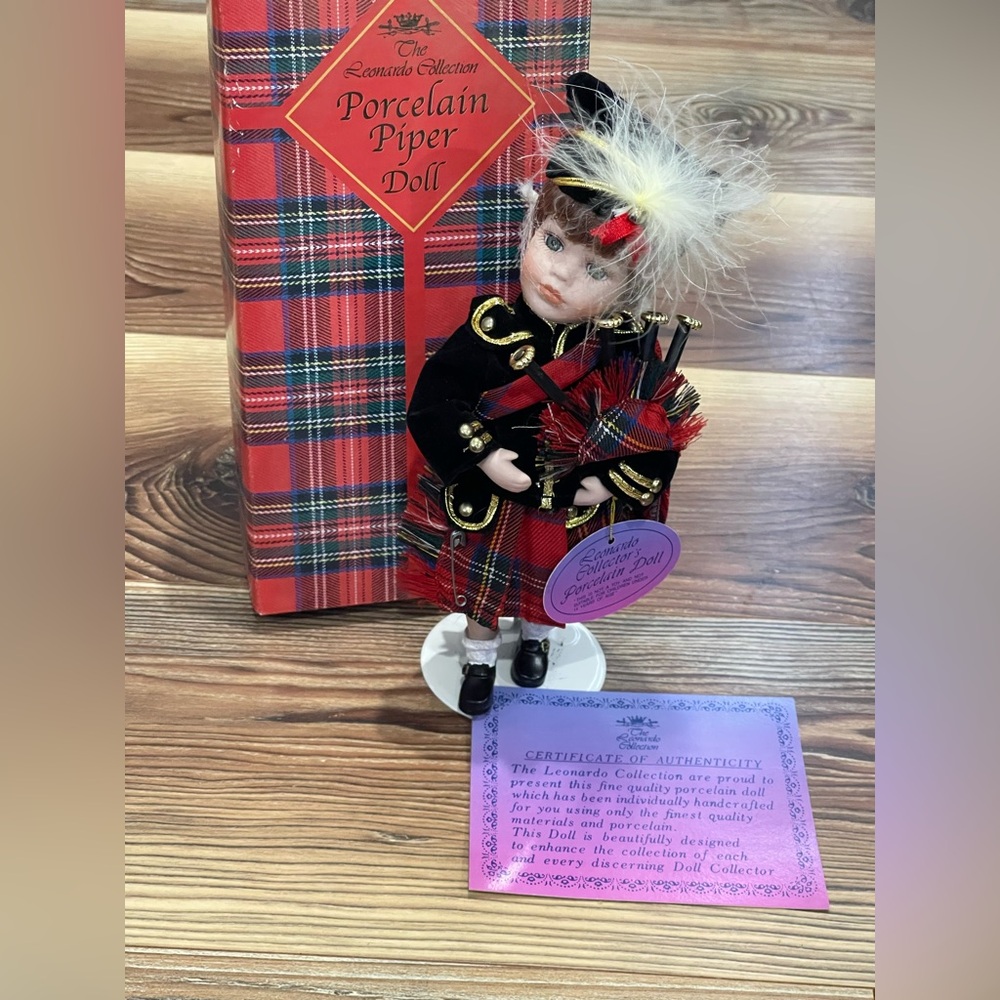 New w Imperf The Leonardo Collection “The Piper” w  Stand Porcelain Doll w Stand